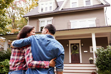 two people walking into their new home